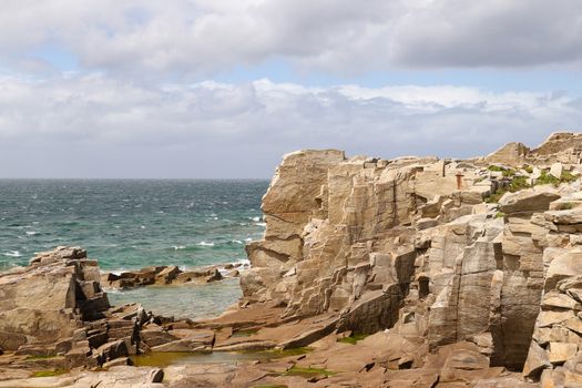 Cliffs on the coast of the Ile Grande - Big Island - in Pleumeur-Bodou in Brittany, France