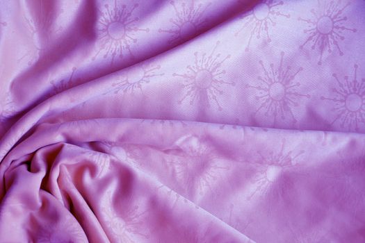 texture of pink textile material in a fold for background close up