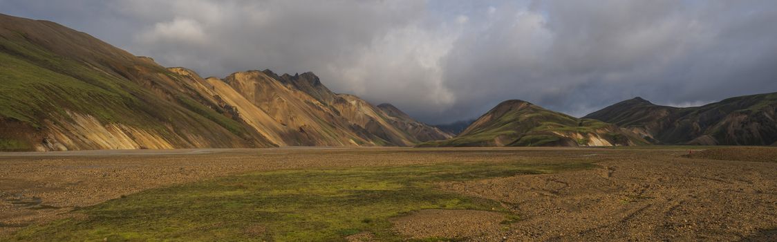 Beautiful scenic panorama of colorful volcanic mountains in Landmannalaugar camp site area of Fjallabak Nature Reserve in Highlands region of Iceland.