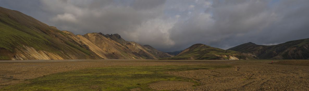 Beautiful scenic panorama of colorful volcanic mountains in Landmannalaugar camp site area of Fjallabak Nature Reserve in Highlands region of Iceland.