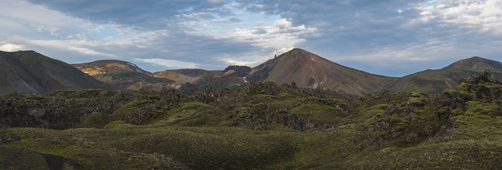 Beautiful scenic panorama of colorful volcanic mountains in Landmannalaugar camp site area of Fjallabak Nature Reserve in Highlands region of Iceland.