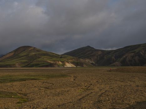 Beautiful scenic panorama of colorful volcanic mountains in Landmannalaugar camp site area of Fjallabak Nature Reserve in Highlands region of Iceland.