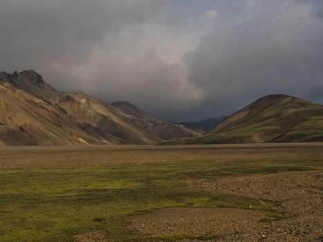 Beautiful scenic panorama of colorful volcanic mountains in Landmannalaugar camp site area of Fjallabak Nature Reserve in Highlands region of Iceland.