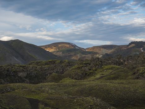 Colorful Rhyolit mountain panorma with multicolored volcanos in Landmannalaugar area of Fjallabak Nature Reserve in Highlands region of Iceland.