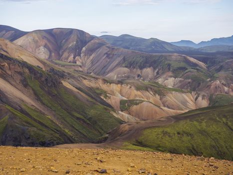 Colorful Rhyolit mountain panorma with multicolored volcanos in Landmannalaugar area of Fjallabak Nature Reserve in Highlands region of Iceland.