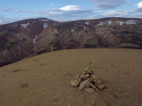 View from top of Brennisteinsalda mountain peak on scenic panorama of colorful volcanic Landmannalaugar mountains. Area of Fjallabak Nature Reserve in Highlands of Iceland.