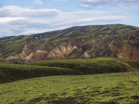 Colorful Rhyolit mountain panorma with multicolored volcanos in Landmannalaugar area of Fjallabak Nature Reserve in Highlands region of Iceland.