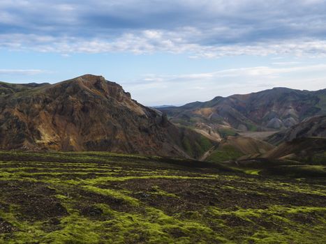 Colorful Rhyolit mountain panorma with multicolored volcanos in Landmannalaugar area of Fjallabak Nature Reserve in Highlands region of Iceland.