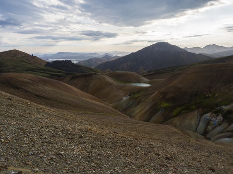 Colorful Rhyolit rainbow mountain panorma with multicolored volcanos. Sunrise in Landmannalaugar at Fjallabak Nature Reserve, Highlands Iceland.