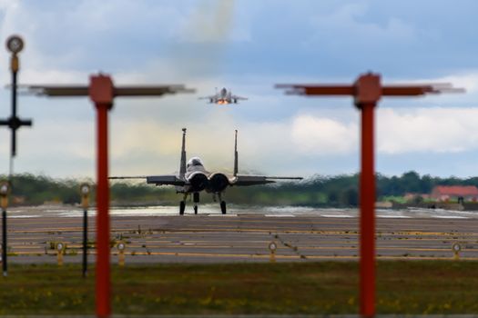 F-15 Eagle aircraft with afterburners departing RAF Lakenheath in England