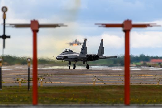 F-15 Eagle aircraft with afterburners departing RAF Lakenheath in England