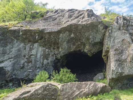 Skuggi rock cave at Laugavegur hike in Thorsmork, Iceland. Summer blue sky.