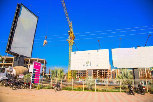 ranchi, India - june 2019 : a big car parking near under construction buildings in ranchi