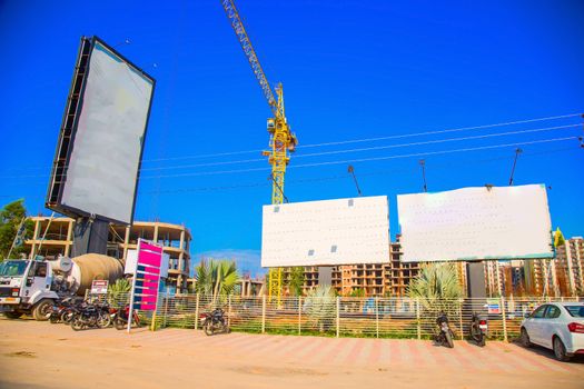 ranchi, India - june 2019 : a big car parking near under construction buildings in ranchi