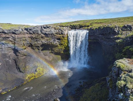 Beautifull waterfall on the Skoga River with rainbow and no people on famous Fimmvorduhals trail second part of Laugavegur trek. Summer landscape on a sunny day. Amazing in nature. August 2019, South Iceland.