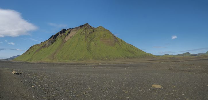 Panoramic view on green Hattafell mountain in Volcanic landscape behind Emstrur camping site on Laugavegur trek. Area of Fjallabak Nature Reserve in Highlands region of Iceland.