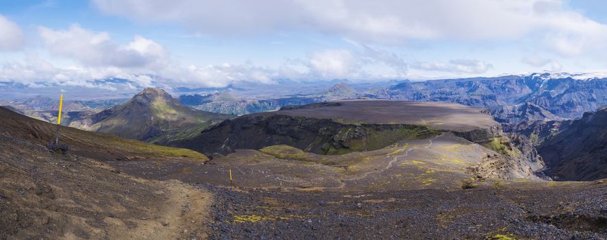 Panoramic breathtaking view on Landscape of Godland and thorsmork over plateau of Morinsheidi with rugged green moss covered rocks and hills. Iceland, Fimmvorduhals hiking trail. Summer cloudy day