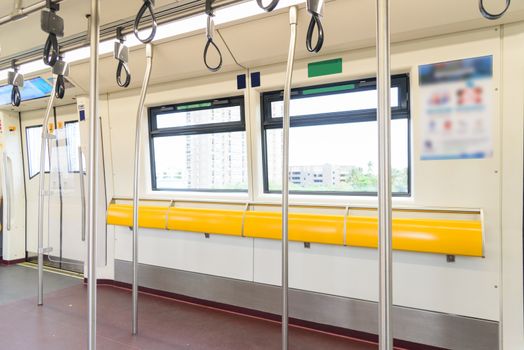 empty seat and pole in sky train