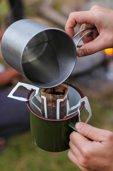 Pour hot water into a bag of drip coffee.