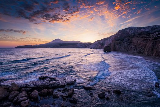 Fyriplaka beach and waves of Aegean sea on sunset, Milos island, Cyclades, Greece