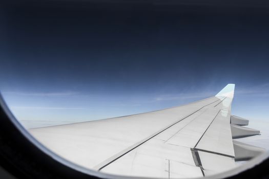 View from an airplane window at high altitude and turbines about Africa.