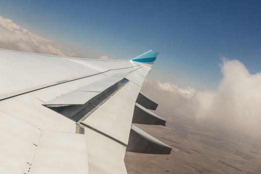 View from an airplane window at high altitude and turbines about Africa.