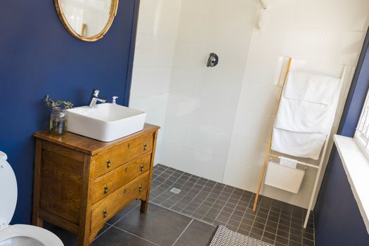 Noble little bathroom, toilet in royal blue in a hotel in Cape Town, South Africa.