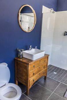 Noble little bathroom, toilet in royal blue in a hotel in Cape Town, South Africa.