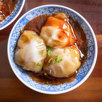 Bawan (Ba wan), Taiwanese meatball delicacy, delicious street food, steamed starch wrapped round shaped dumpling with pork inside, close up, copy space