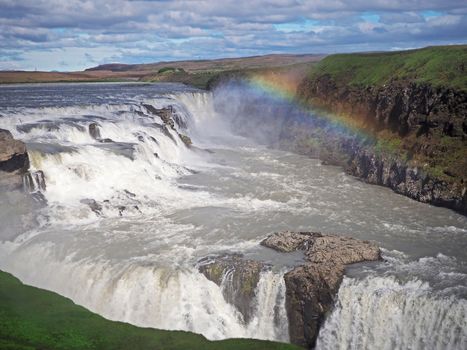 Beautiful Gullfoss waterfall with rainbow overon the Hvita River in southwest Iceland