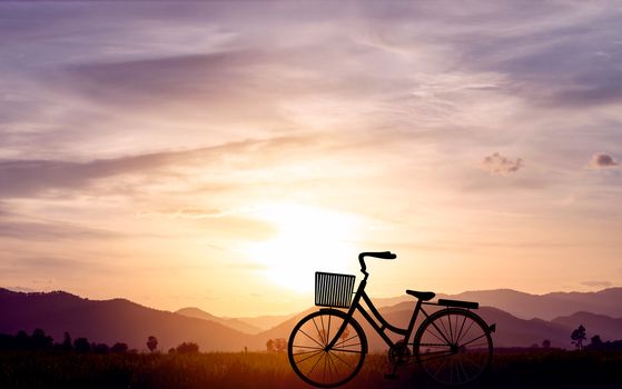 Silhouette women bike at sunset on mountain hills and sky cloud. Vector illustration design