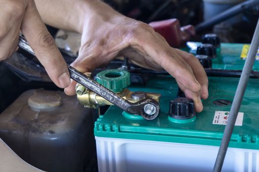 Repairing the battery by a technician from the service center. Service shop Battery repair