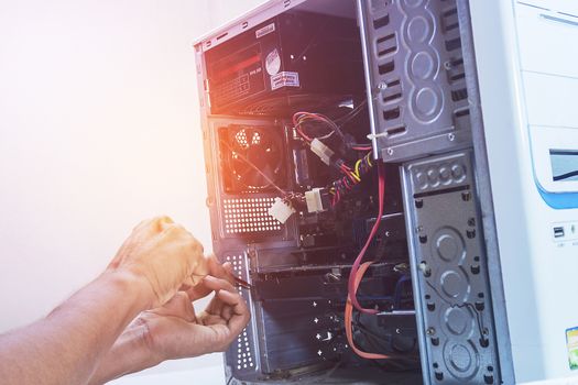 Technician computer pc repairing graphic card or cleaning. In the computer service center