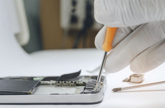 Phone motherboard or Fixing repairs into the motherboard for smartphone in lab By professional technician on desk.