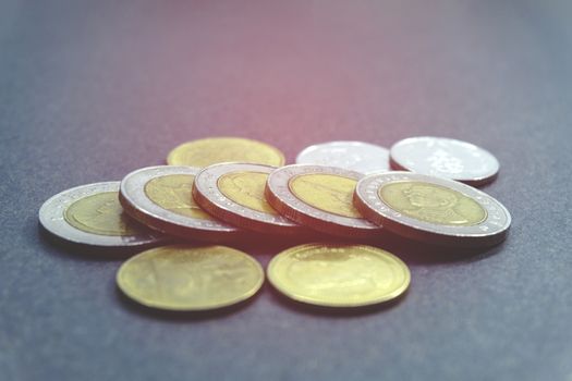 Thai baht of coins Set of Currency coin 1, 2, 5, and 10 baht of Thailand on black background