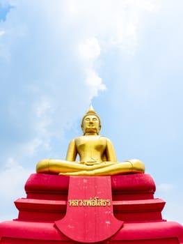 PATHUM THANI, THAILAND - May 2 : 2020. Beautiful big buddha with Thai languash name "Luang Phor Sothorn" on blue sky background at Wat Bot Temple at Pathum Thani, THAILAND, vertical style.