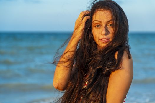 A beautiful brunette model enjoys the sunset in the Yucatán Peninsula near Merida, Mexico