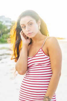 A beautiful brunette model enjoys the sunset in the Yucatán Peninsula near Merida, Mexico