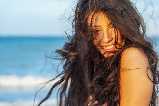 A beautiful brunette model enjoys the sunset in the Yucatán Peninsula near Merida, Mexico