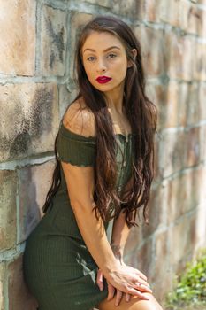 A gorgeous brunette model enjoys a spring day outdoors