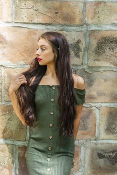 A gorgeous brunette model enjoys a spring day outdoors