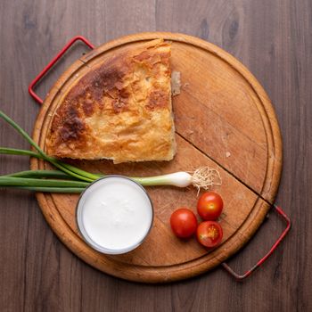 Traditional balkan breakfast - Borek or Burek pie with meat aranged on wooden table