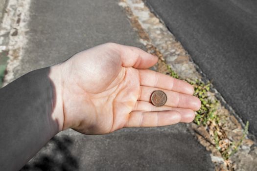 Old dirty coin found. In the hand. Cape Town in South Africa.