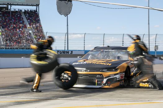 Kurt Busch (1) and crew make a pit stop for the FanShield 500 at Phoenix Raceway in Avondale, Arizona.