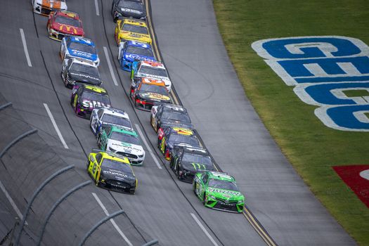 Kyle Busch (18) races for position for the GEICO 500 at Talladega Superspeedway in Lincoln, Alabama.