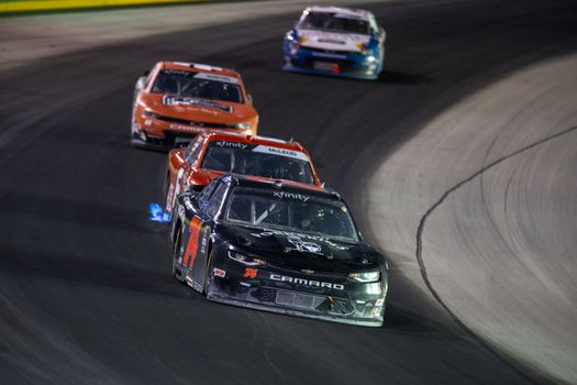 Bayley Currey (74) races for position for the Alsco 300 at Kentucky Speedway in Sparta, Kentucky.
