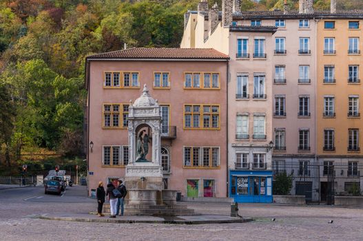 Lyon, France -- November 6, 2017 -- A public square where some people have gathered by a statue. Editorial Use Only.