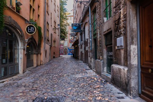 Lyon, France--November 6, 2017--A cobblestone side street with a jazz club and pubs in the old city section of Lyon.