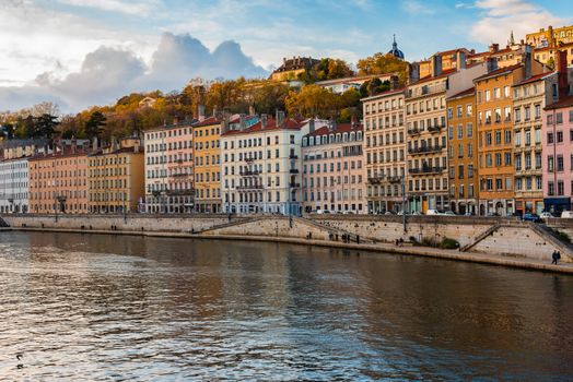 Lyon, France -- November 5, 2017. Photo of colorful apartment buildings situated along the banks of the Saone River.