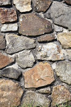 Old weathered rustic stone brick wall texture background